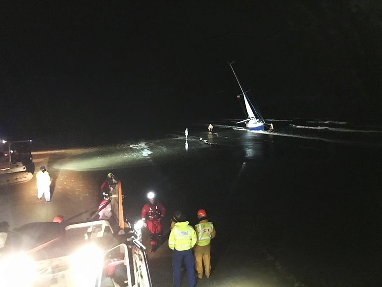 Lifeboats and coastguard attend the grounded yacht 'Trouncer' on Holkham beach, 20/3/20