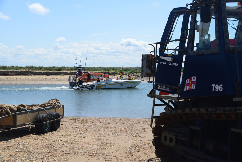 Wells Lifeboat bringing the power boat Big Old Cat into harbour 7/7/19