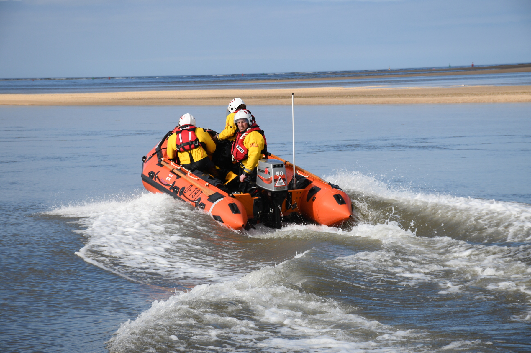 ILB launching early on the flood to two people and a dog cut off on the sandbar west of the harbour entrance