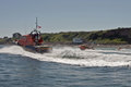 Lifeboats at speed off Sheringham boathouse for the RNLI 200th Sheringham Lifeboat Open Day